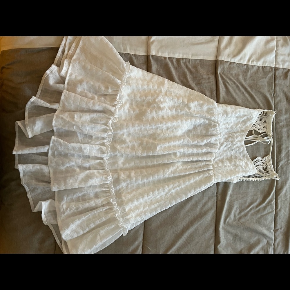 XS White mesh dress with open back and tie string on the Top.